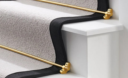 Pushka stair rods on a grey carpet