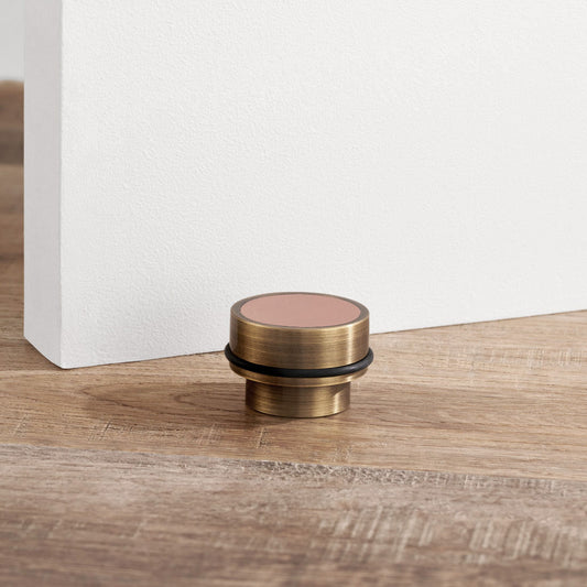 Brass & Pink Leather Mounted Door Stops in Antique