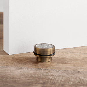 Brass & Grey Terrazzo Floor Mounted Door Stops in Antique