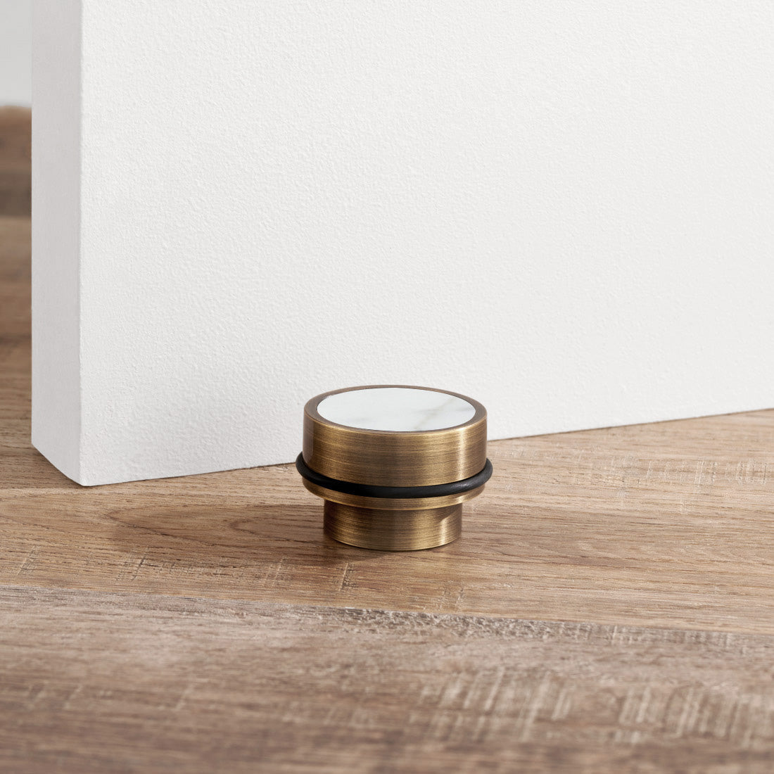 Brass & White Terrazzo Floor Mounted Door Stops in Antique