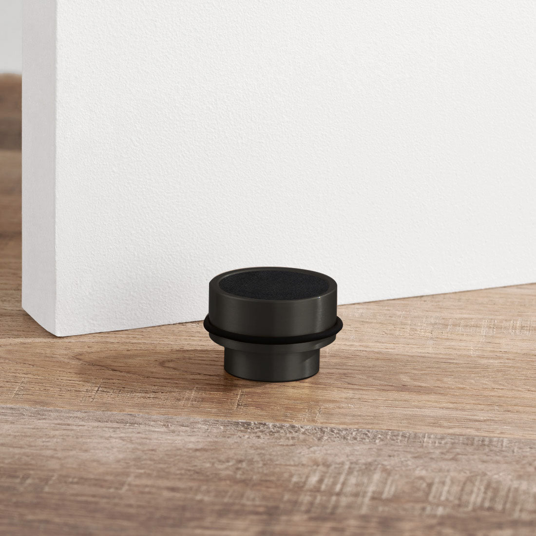Brass & Black Leather Mounted Door Stops in Black