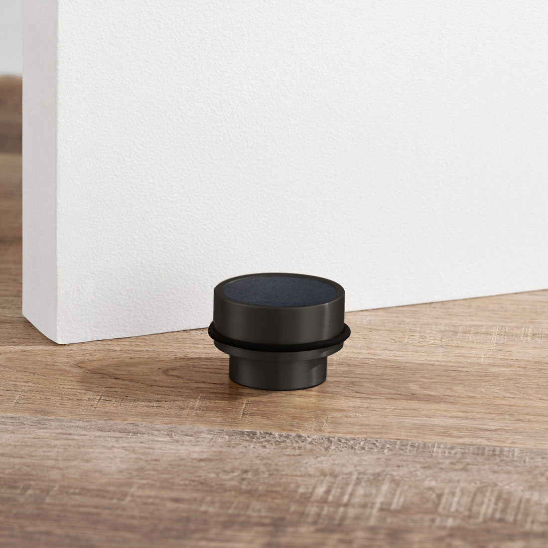 Brass & Blue Leather Mounted Door Stops in Black