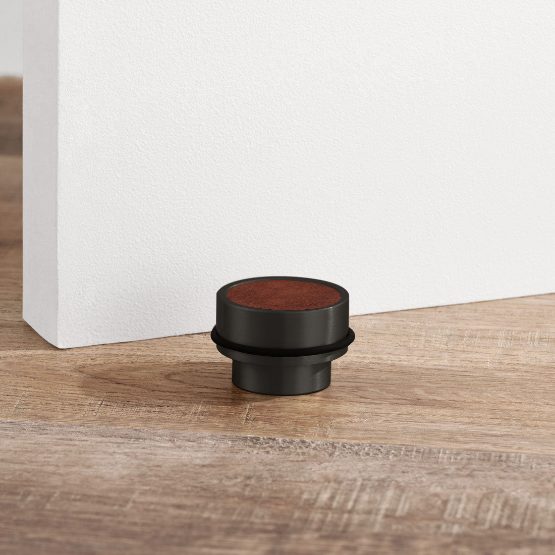 Brass & Brown Leather Mounted Door Stops in Black