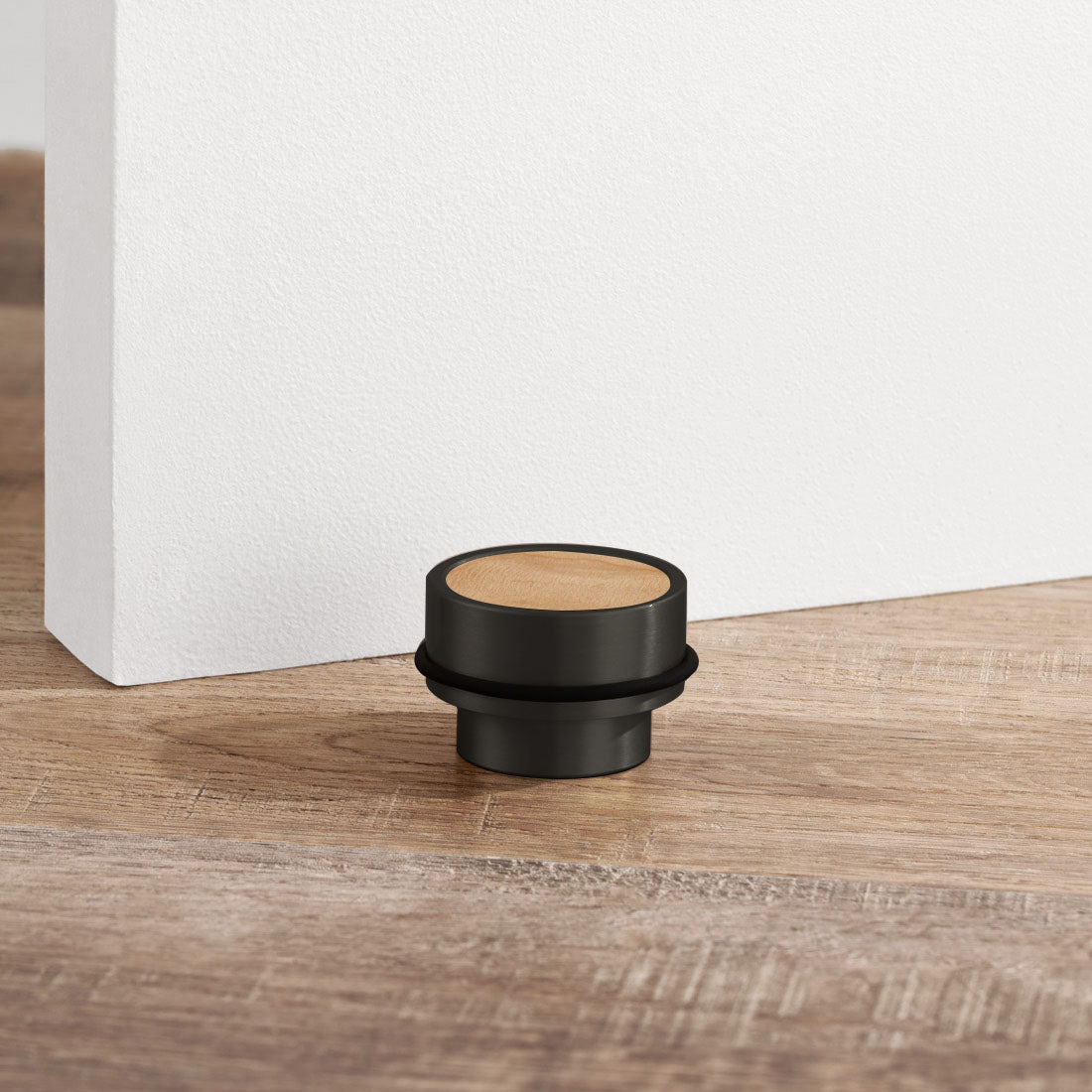 Brass & Maple Wood Floor Mounted Door Stops in Black