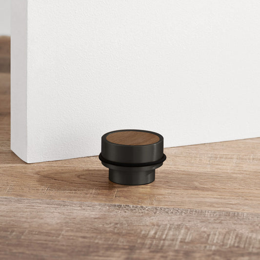 Brass & Walnut Wood Floor Mounted Door Stops in Black