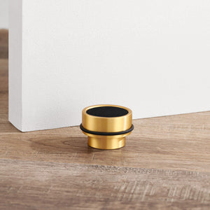 Brass & Black Leather Mounted Door Stops in Gold