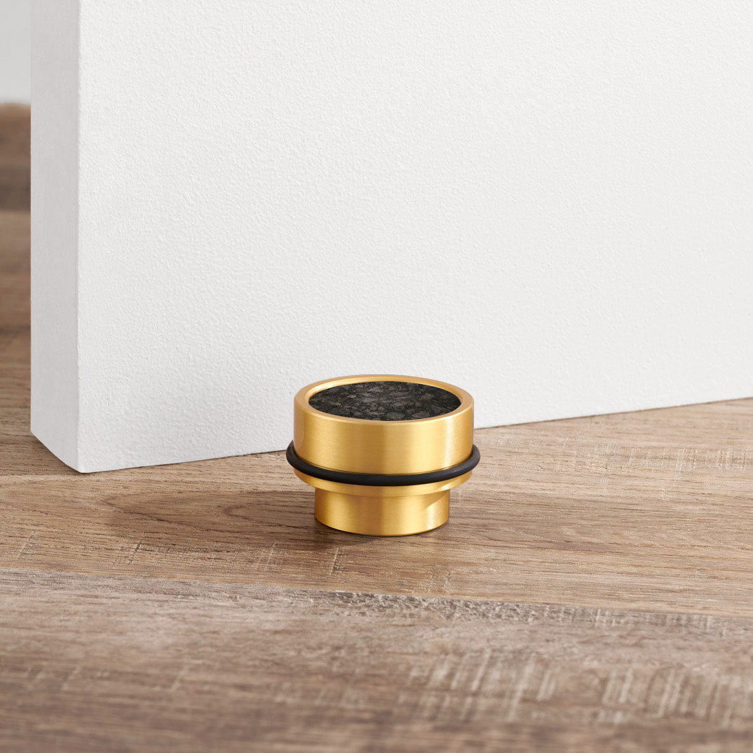 Brass & Black Terrazzo Floor Mounted Door Stops in Gold