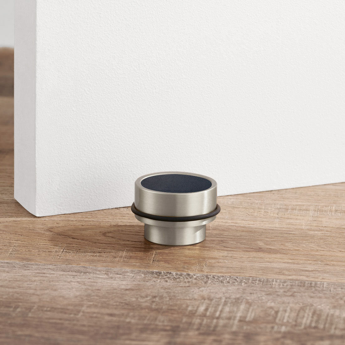 Brass & Blue Leather Mounted Door Stops in Silver