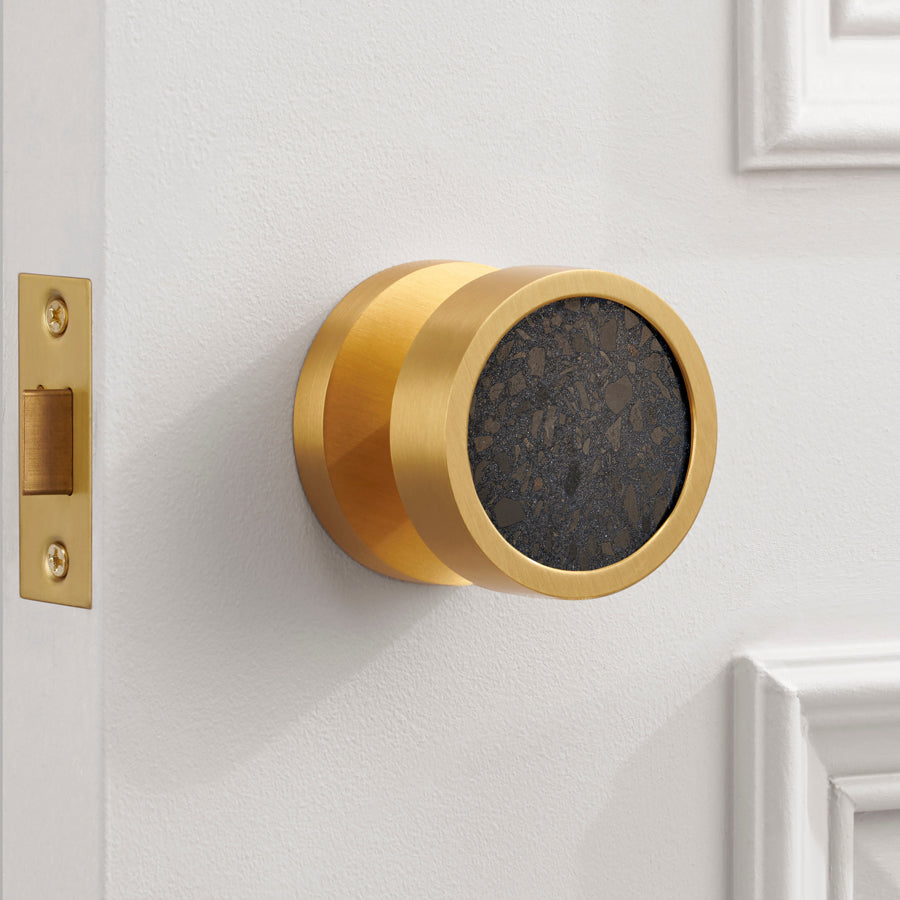 brass and terrazzo door knob in situ
