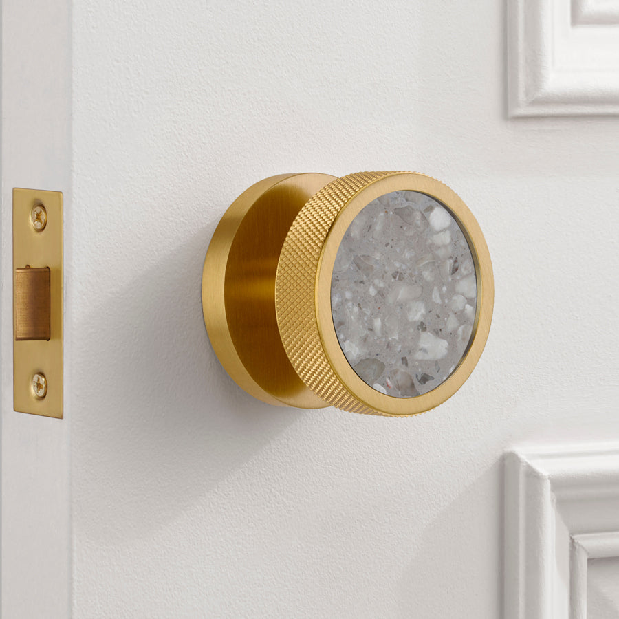 knurled brass and terrazzo door knob in situ
