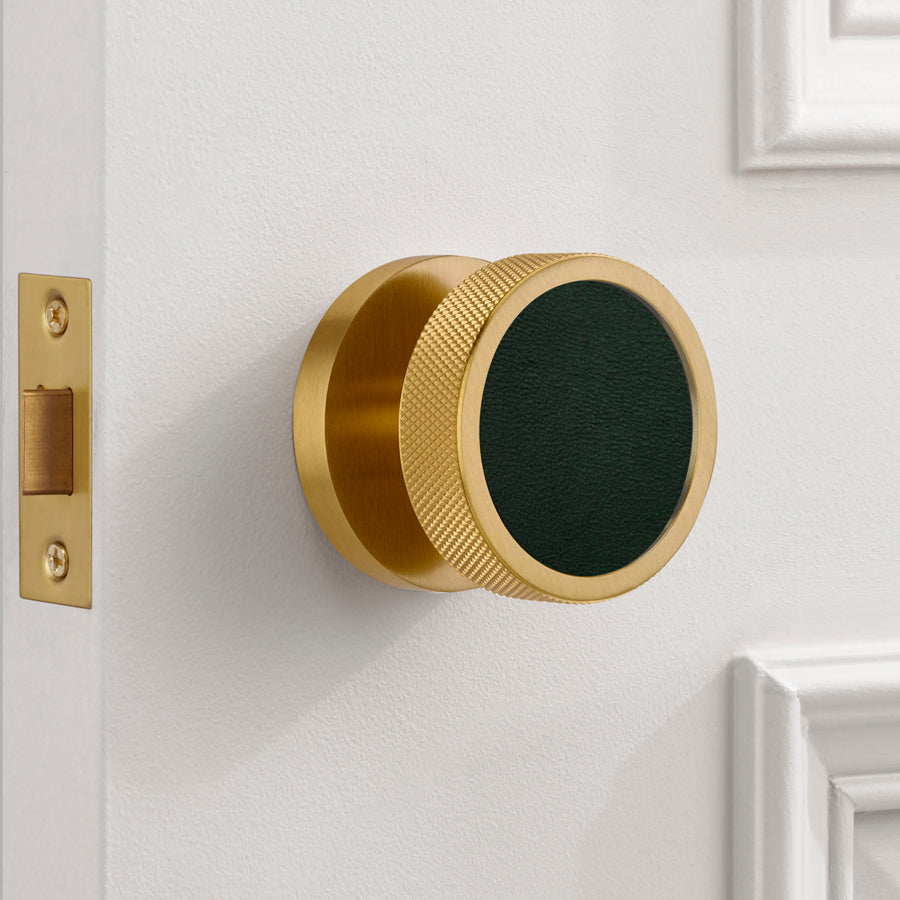 brass and leather knurled mortice door knob in situ
