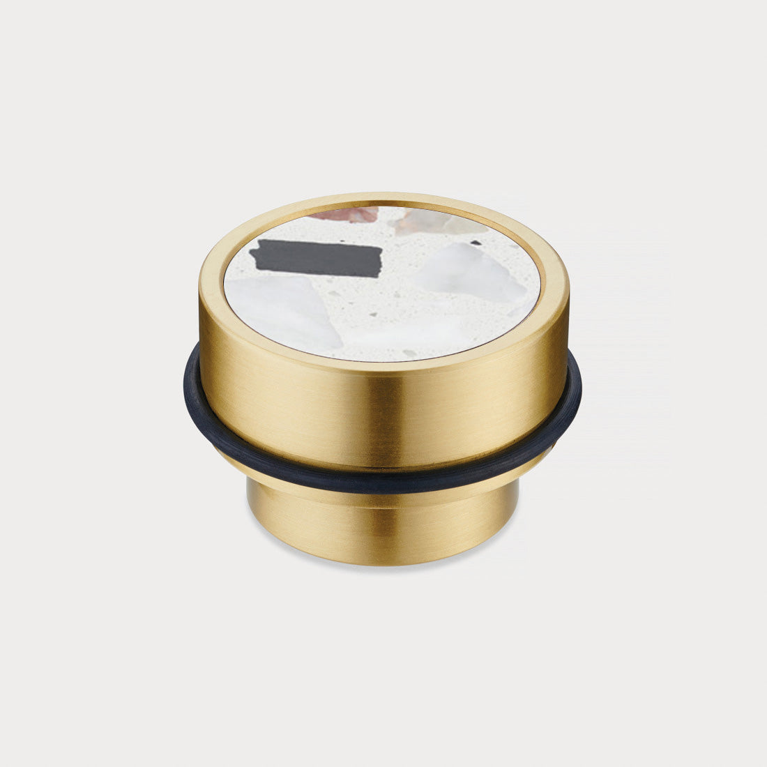Brass & White Fleck Terrazzo Floor Mounted Door Stops in Gold
