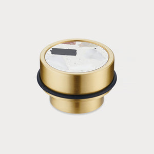 Brass & White Fleck Terrazzo Floor Mounted Door Stops in Gold