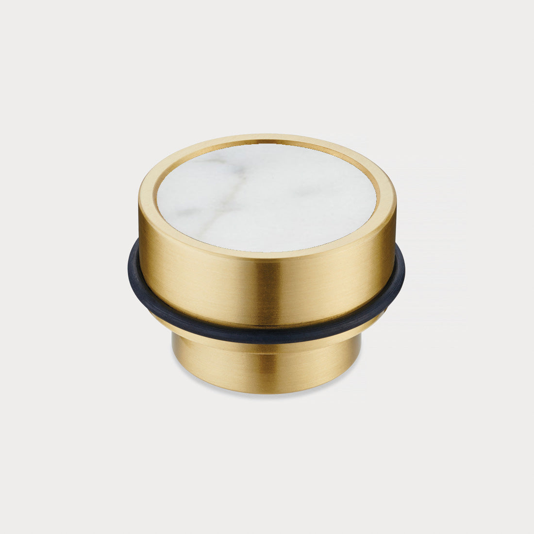 Brass & White Terrazzo Floor Mounted Door Stops in Gold