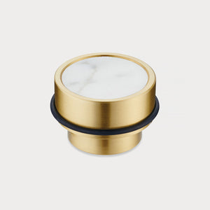 Brass & White Terrazzo Floor Mounted Door Stops in Gold