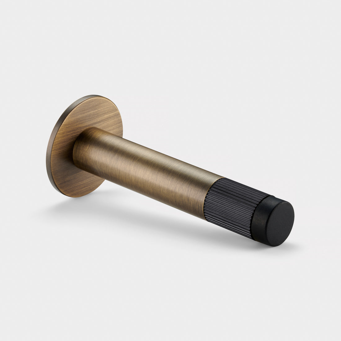 Brass Linear Wall Mounted Door Stop in Antique and Black