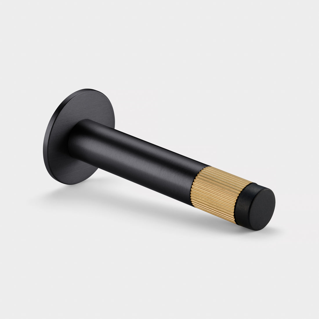 Brass Linear Wall Mounted Door Stop in Black and Gold